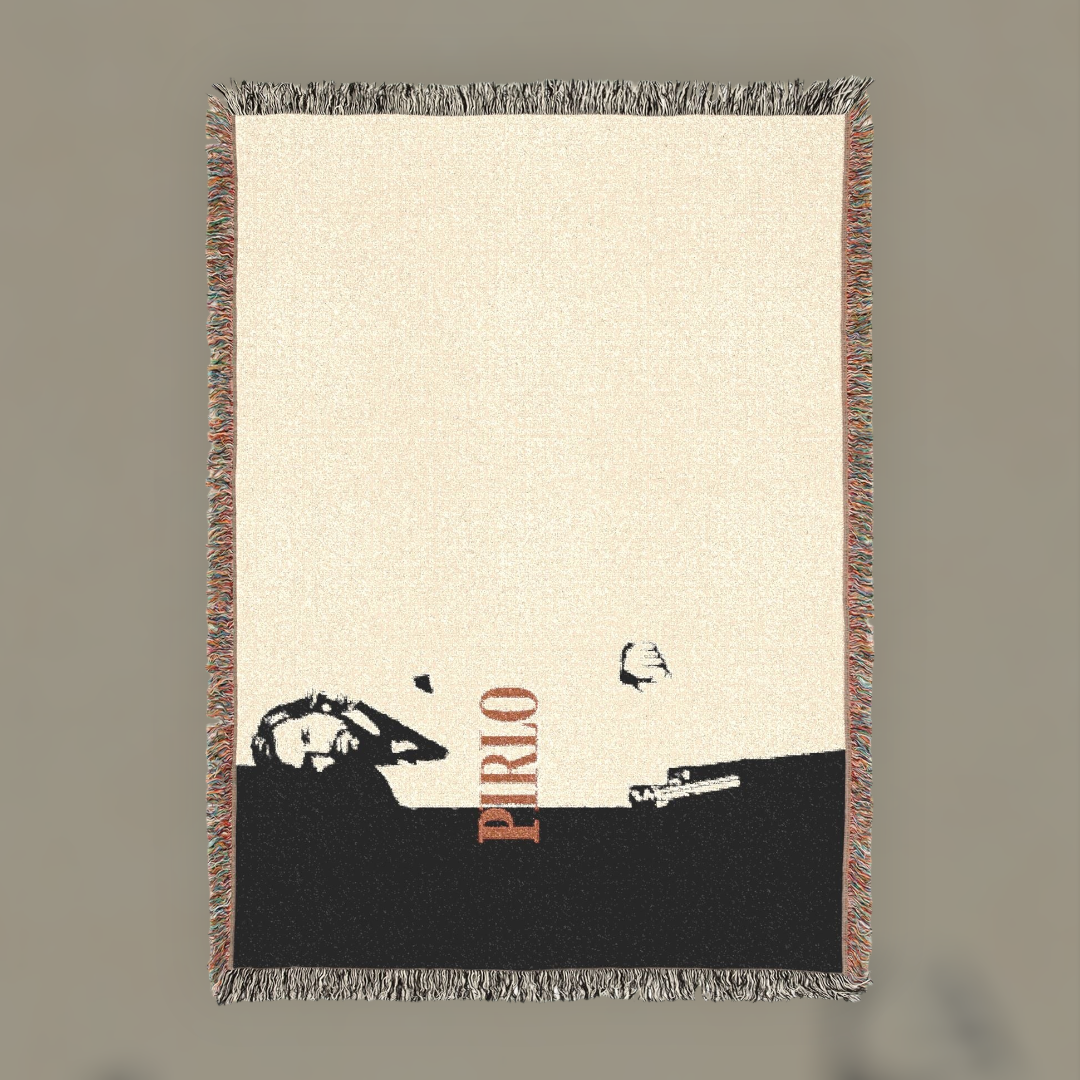 Futbol Addict Pirlo Scarface woven cotton blanket with a black and cream portrait design and colorful fringed edges.