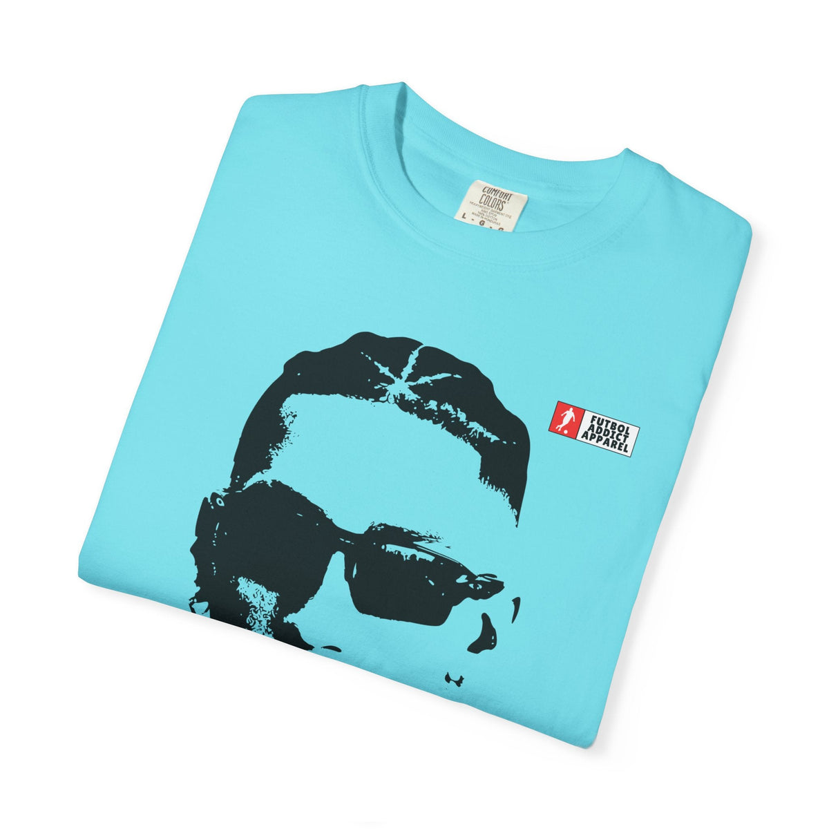 Futbol Addict Raphinha graphic tee in light blue cotton with a black portrait print and small brand logo on chest.