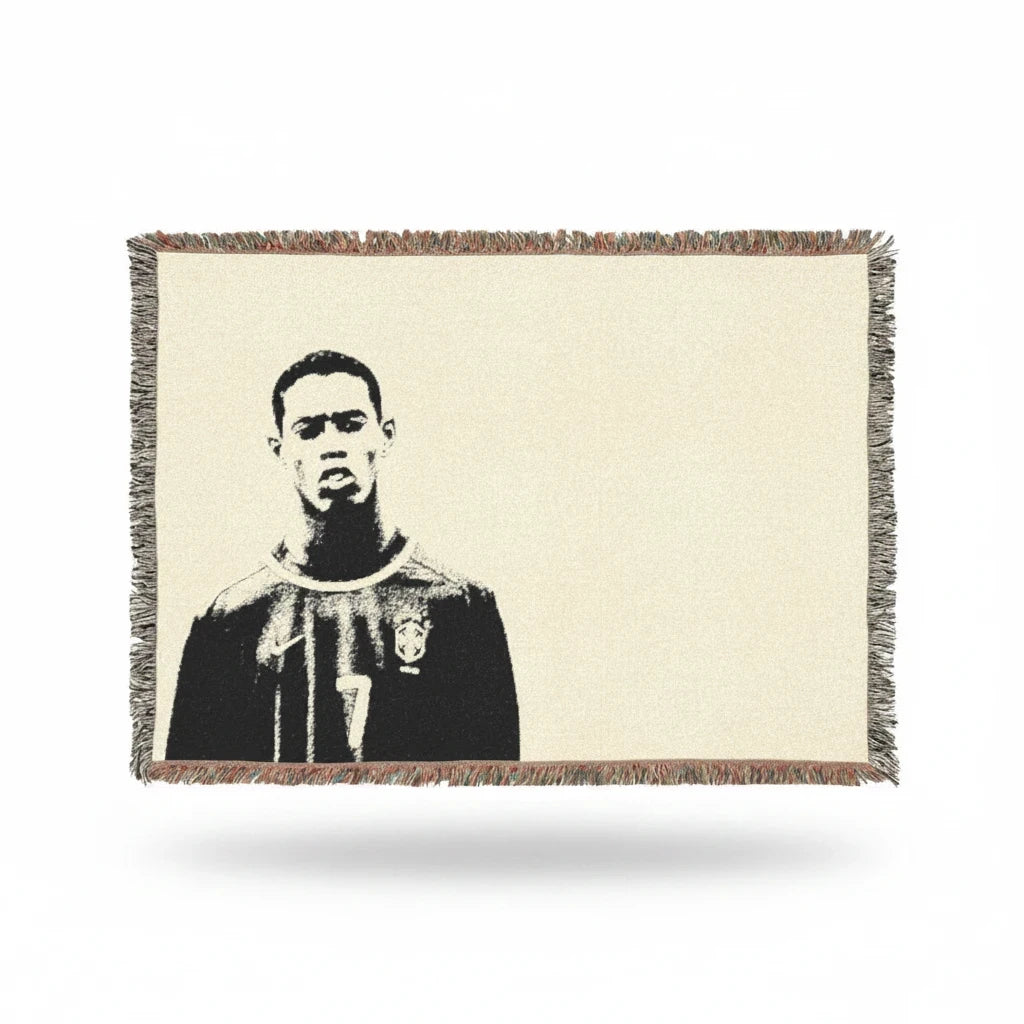 Futbol Addict woven cotton blanket featuring a portrait of young Ronaldinho with colorful fringed edges