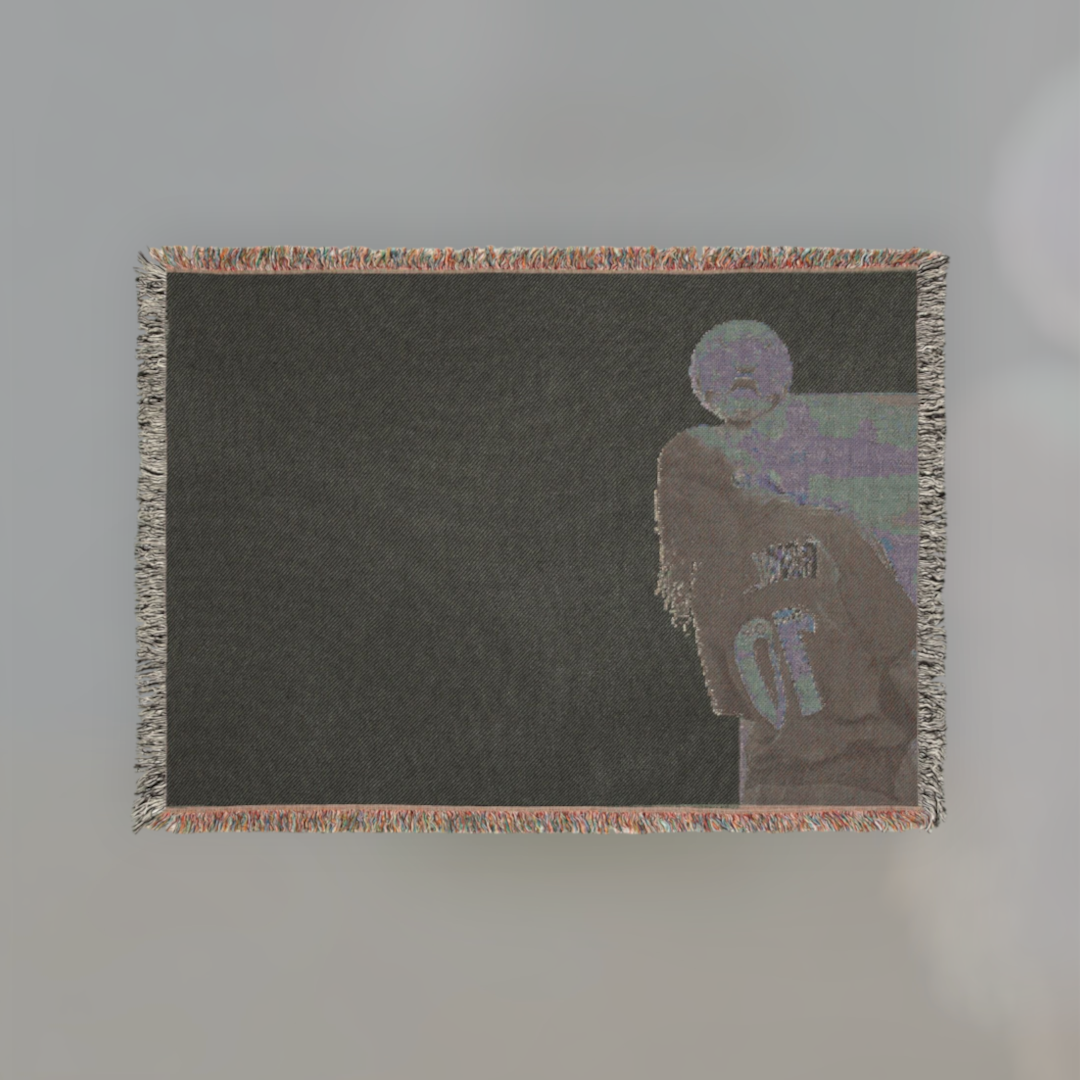 Futbol Addict Ronaldinho woven cotton blanket with colorful fringed edges and a graphic of the football legend.