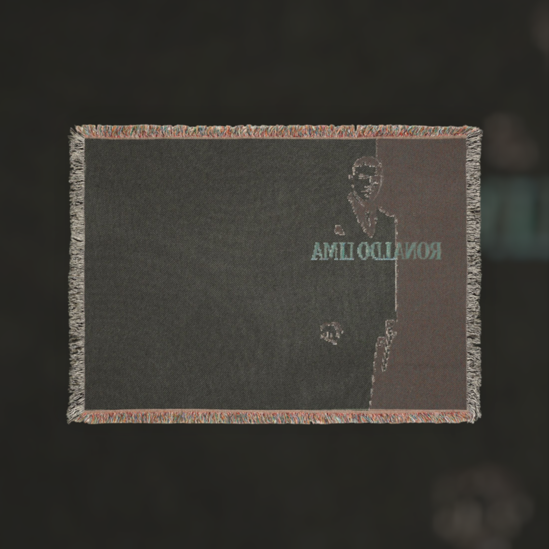Futbol Addict Ronaldo Lima Scarface woven cotton blanket featuring a dark portrait and colorful fringed edges.