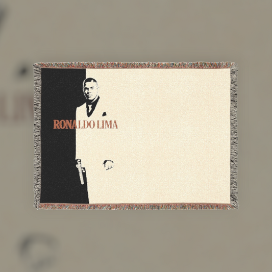 Futbol Addict Ronaldo Lima Scarface woven cotton blanket featuring a black and white portrait with fringed edges.